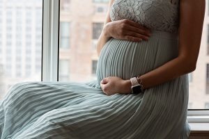 pregnant woman in evening dress holds hands on bel 2023 11 27 05 15 48 utc